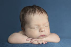 newborn baby boy on a blue blanket