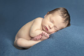newborn baby boy on a blue blanket