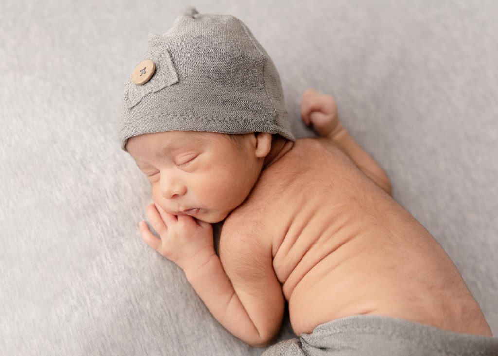Newborn baby in grey