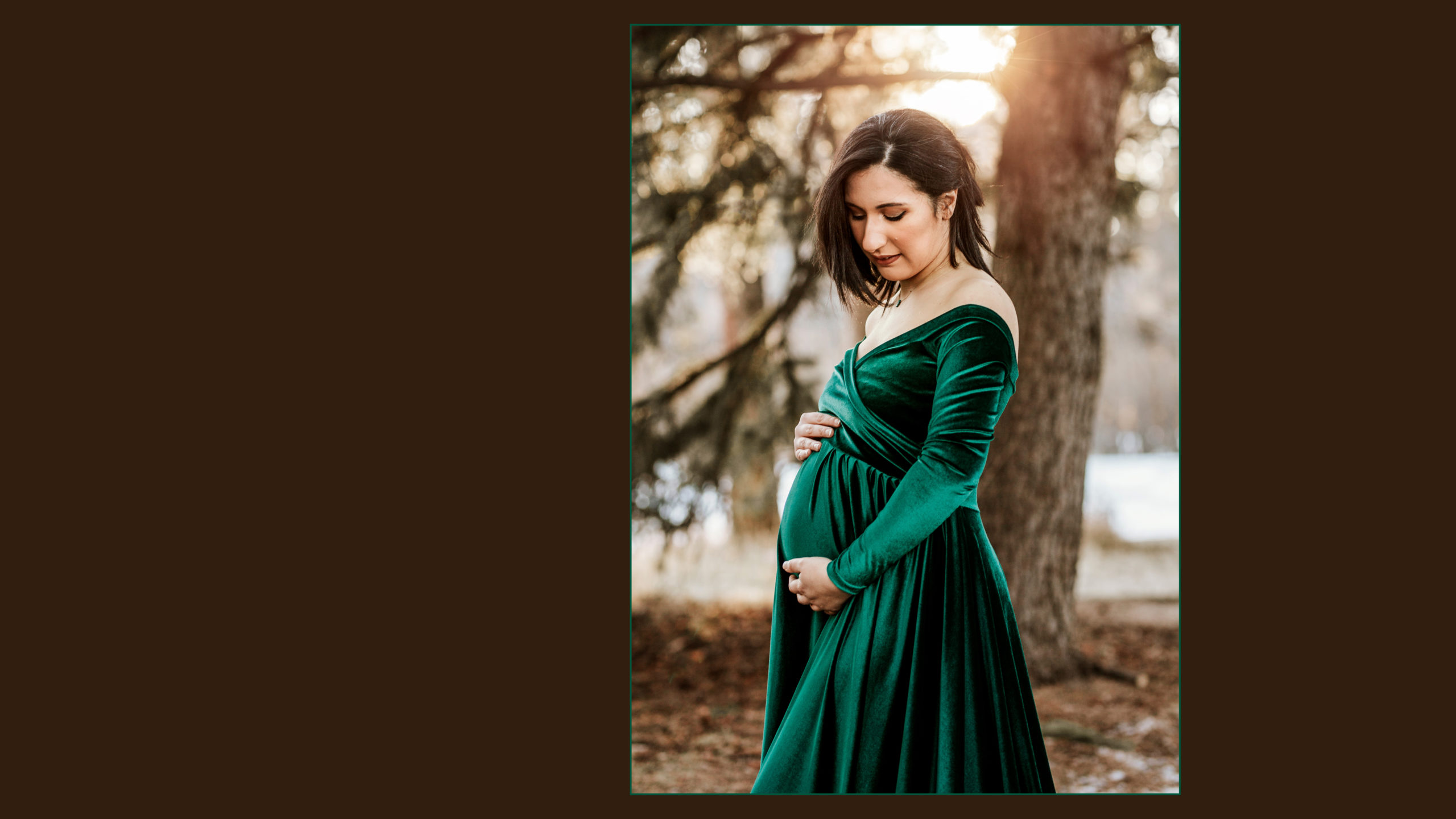 Pregnant lady in a green velvet gown at sunset