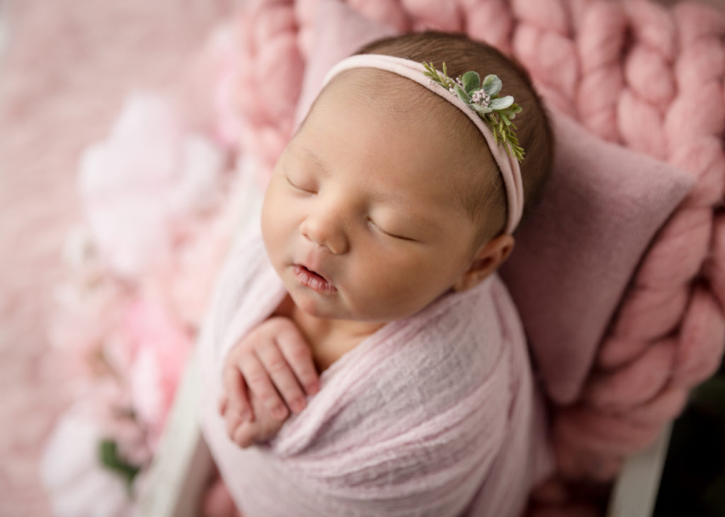 newborn baby girl in pink - pelvic floor