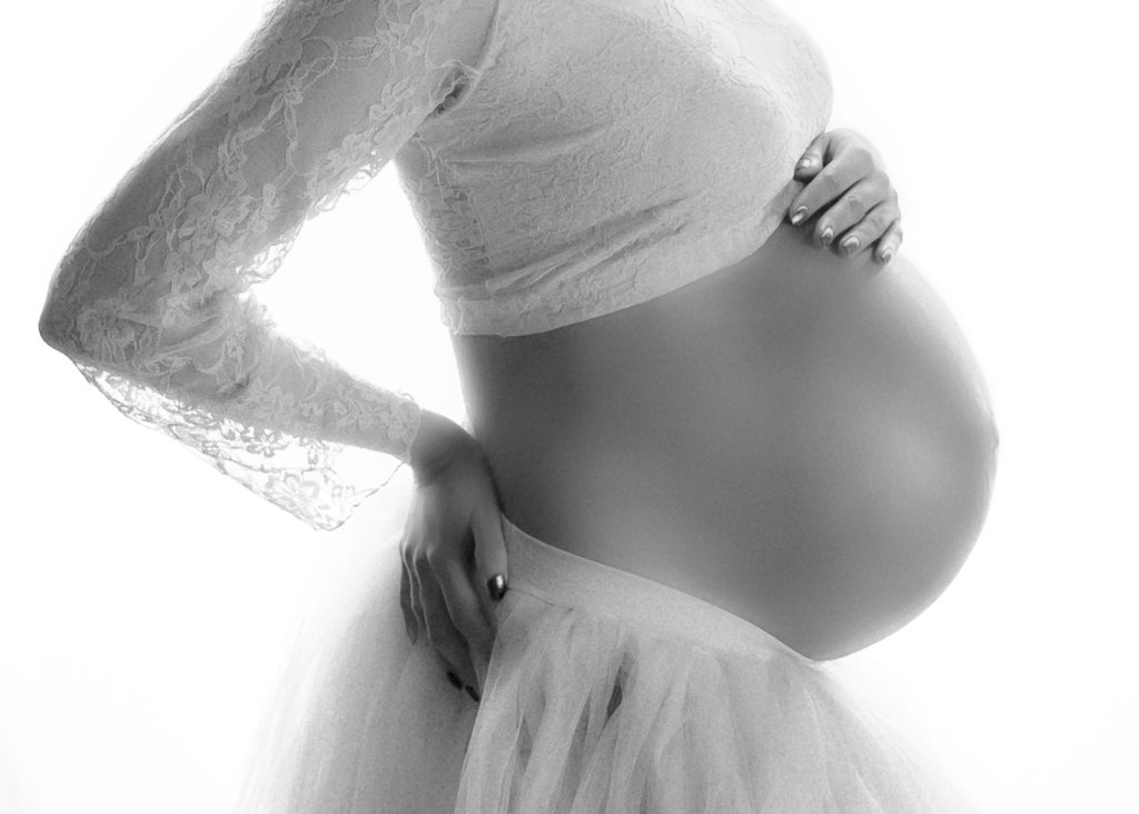 Black and white photo of a pregnant belly 