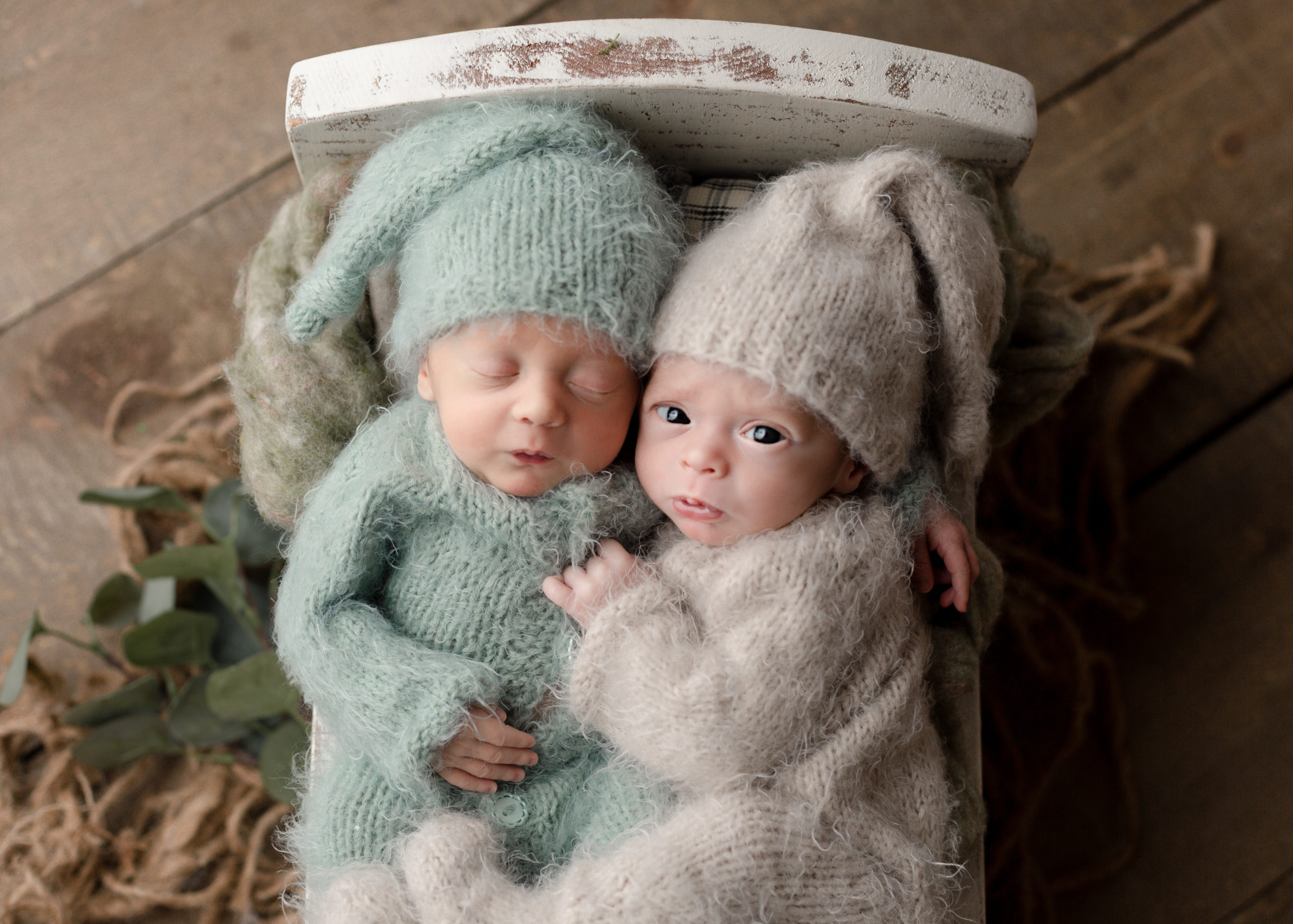 Parents holding a newborn boy twins